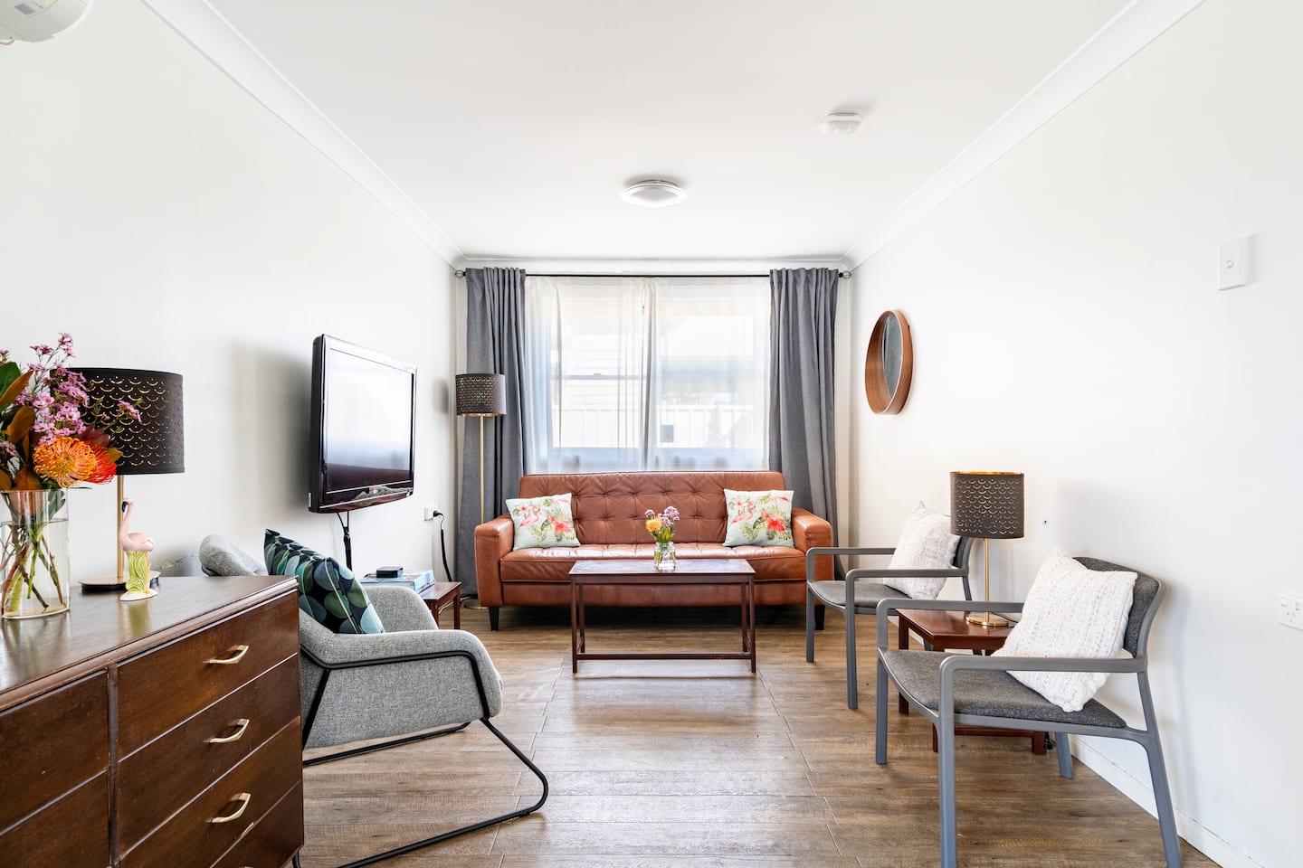 Living room at Flamingo House Hunter Valley with Italian leather sofa and 50 inch smart TV
