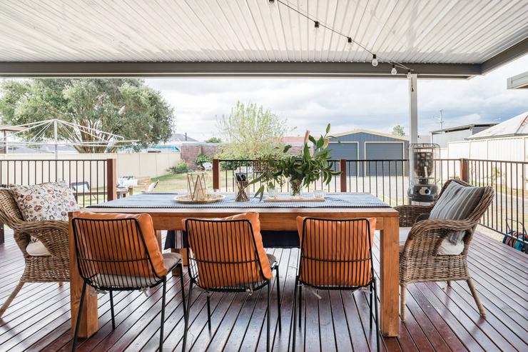 Huge covered deck with 8-person dining table at Flamingo House
