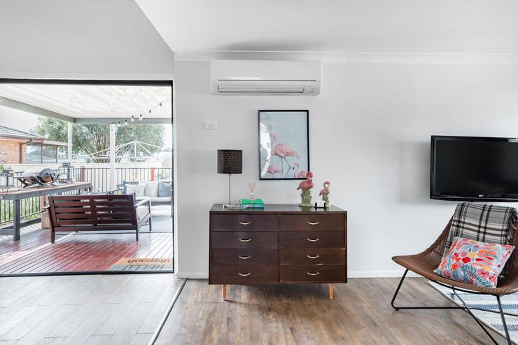 Open plan lounge and dining room with natural light at Flamingo House
