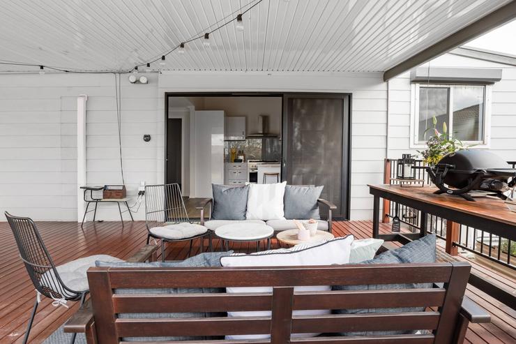 Outdoor gas BBQ and dining setting on the Flamingo House deck