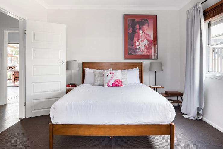 Bedside table and reading lamp in bedroom 1 at Flamingo House