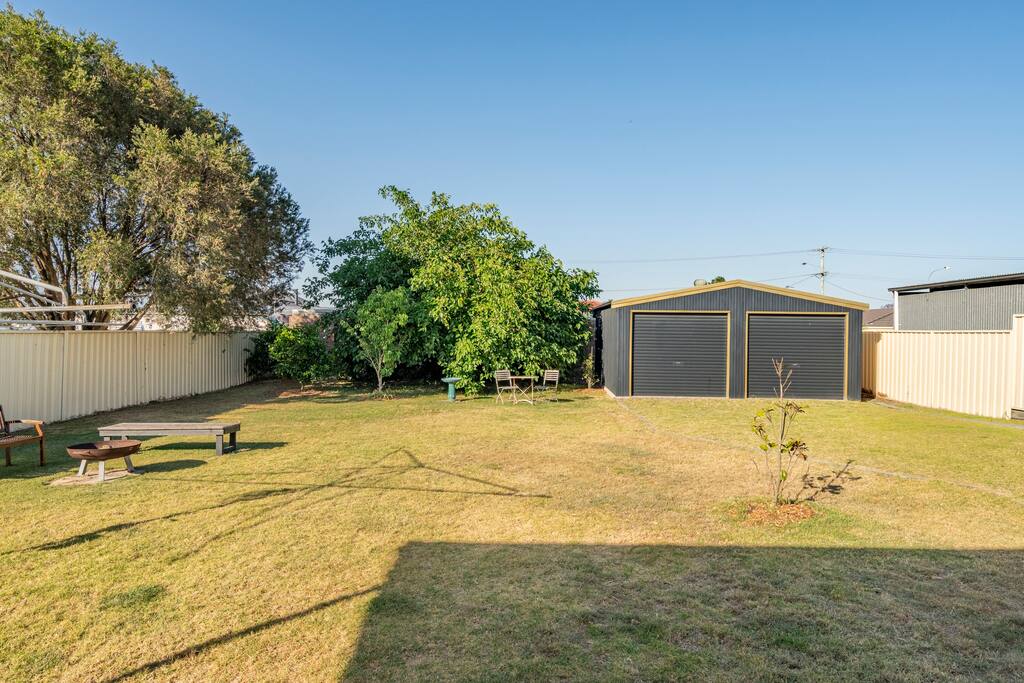 Fully fenced backyard perfect for dogs at Flamingo House