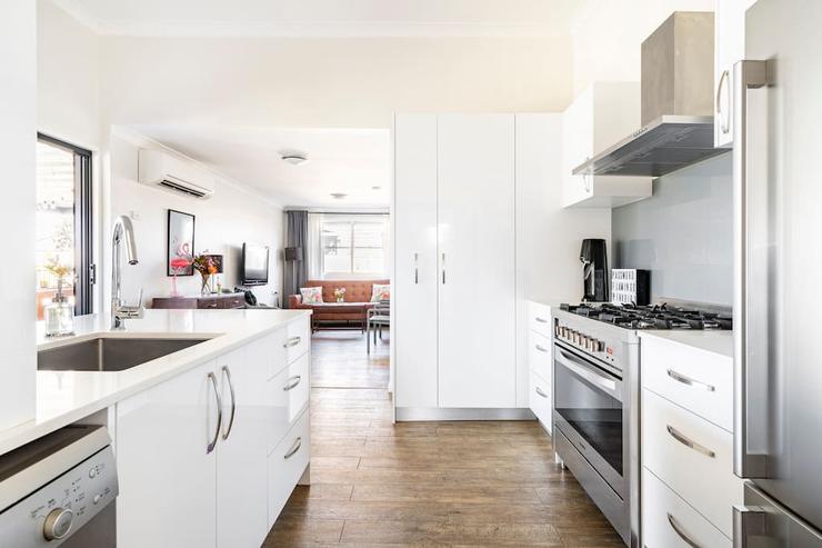 Fully equipped kitchen at Flamingo House with modern appliances and island bench